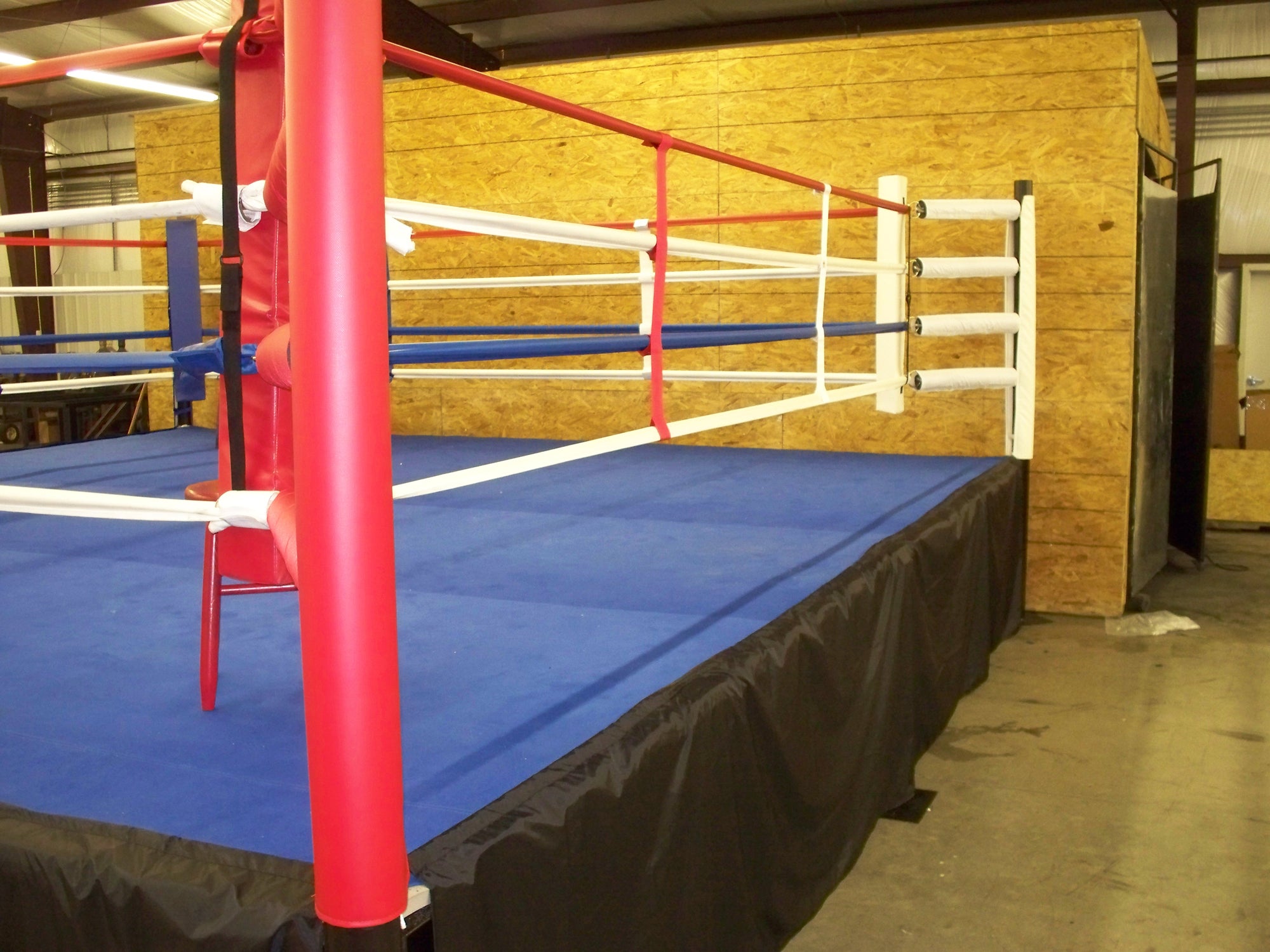 Monster Boxing Pole Cover in red on a Monster Boxing Ring