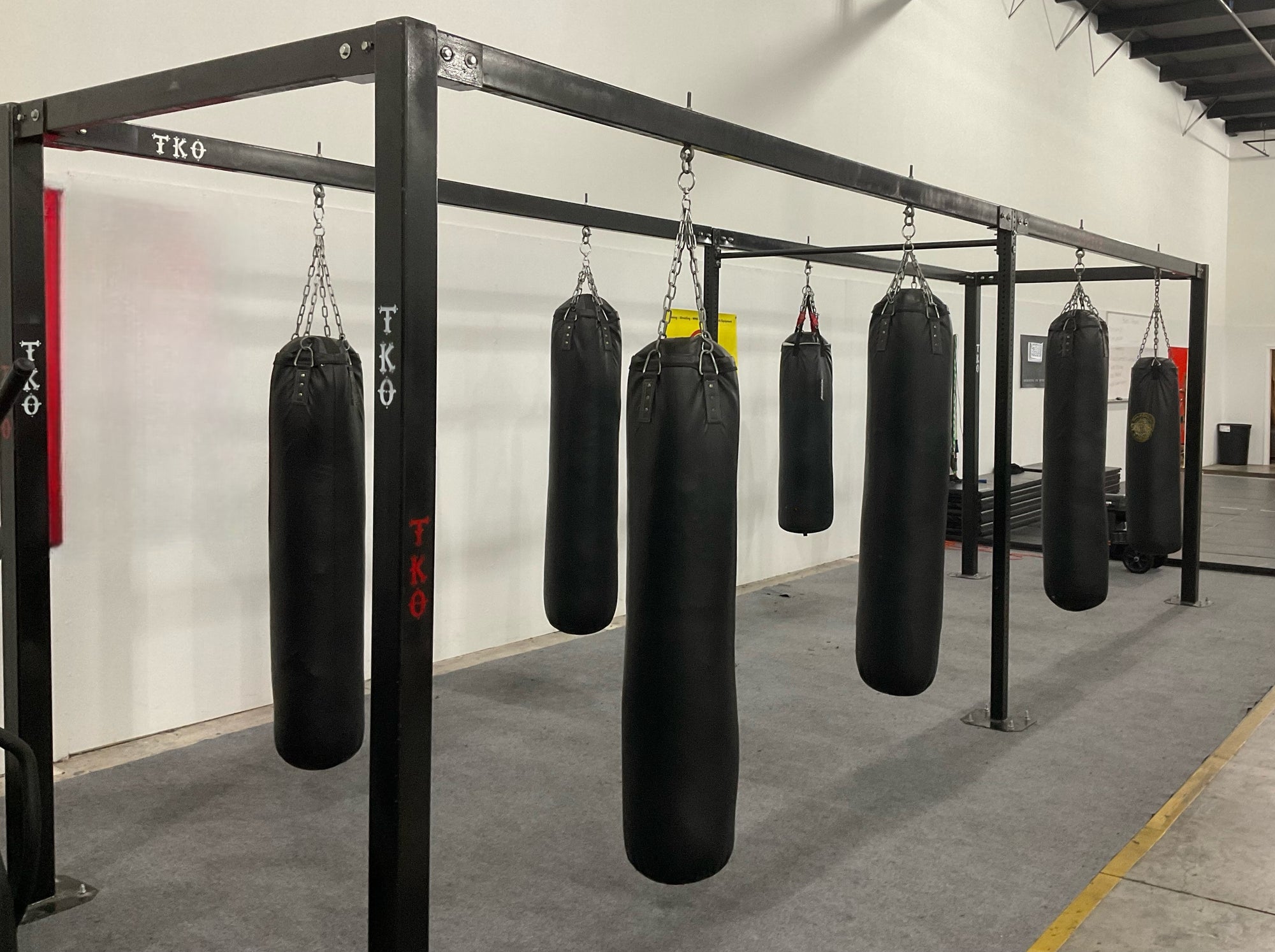 Custom punching bag rack built by Monster Rings and cages