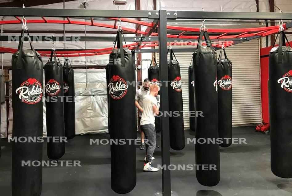 Monster Rings and Cages builds bag racks with monkey bars